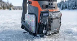 Side pockets and specialized compartments of a backpack cooler for ice fishing storing tackle and tools.