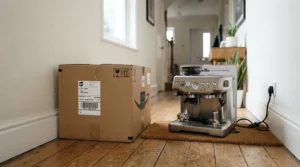 Reviewing Amazon.ca warranty and return policy details alongside a Midea vs Frigidaire window air conditioner box.